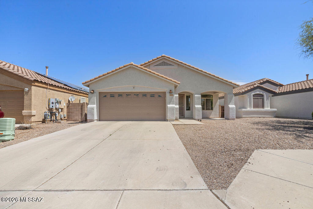 Step into a home that blends modern updates with everyday comfort in the highly sought-after Vail School District in Mesquite Ranch. Fresh interior paint, updated flooring, and an abundance of natural light create a warm, inviting atmosphere from the moment you walk in. The spacious primary suite provides a relaxing retreat with dual vanities and plenty of storage, while the additional bedrooms offer flexibility for family, guests, or a home office. Outside, enjoy a fully fenced backyard with a covered patio, ideal for morning coffee, weekend BBQs, or simply taking in Arizona's beautiful evenings. The Sellers have taken a proactive approach to home maintenance, including recent roof work & HVAC system tuneup.