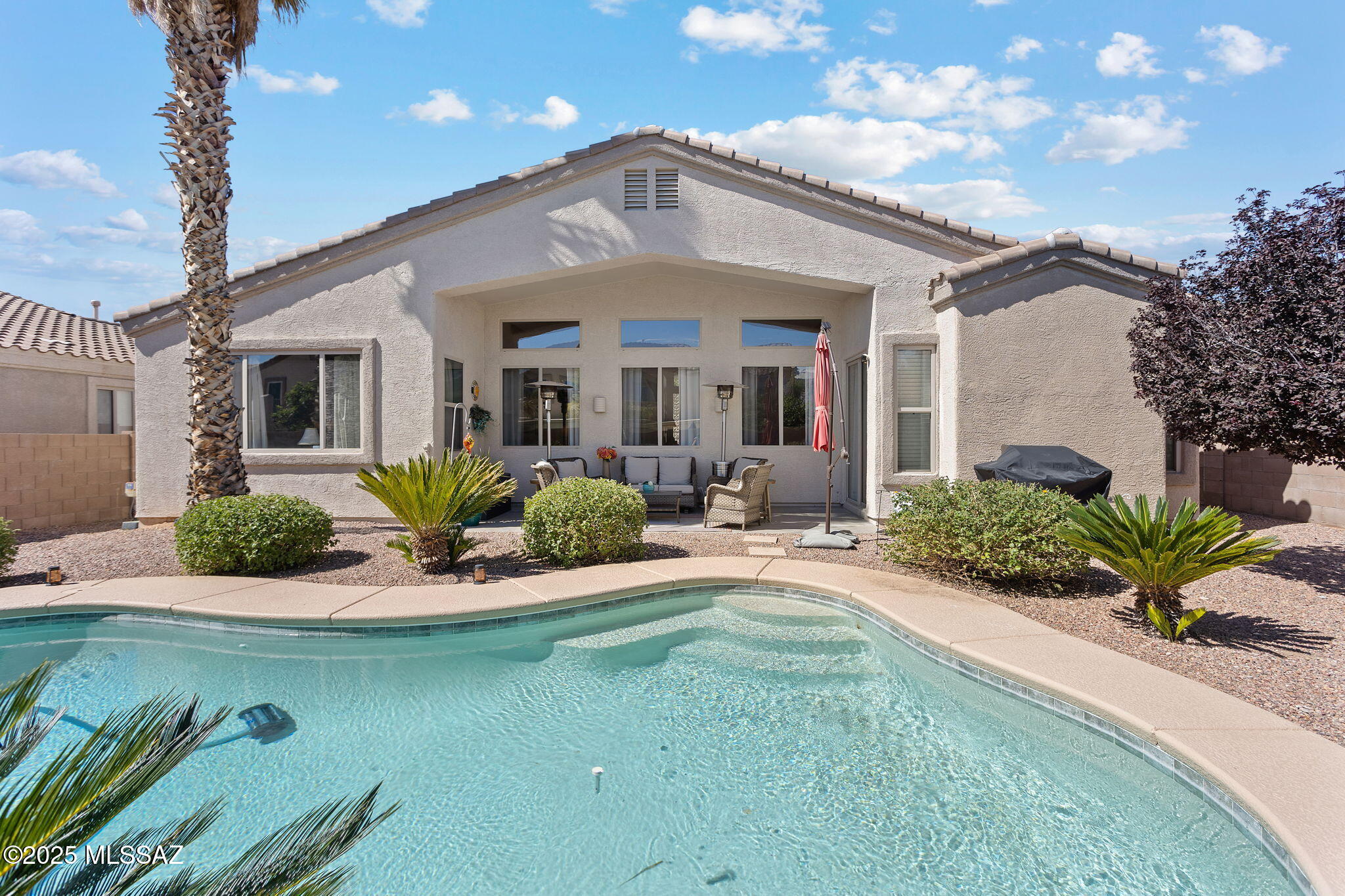 Welcome To Your Dream Home in Oro Valley! ONE story home, nestled in a peaceful cul-de-sac and adjacent to a beautiful park, this stunning property with owned solar is a perfect blend of luxury and comfort. With high ceilings that enhance the spaciousness, the home invites natural light and offers mountain views. The gourmet kitchen features sleek stainless-steel appliances and elegant granite countertops, ideal for cooking and entertaining. This home boasts four generous bedrooms and two baths, providing ample space for families or guests. Step outside to your personal oasis, complete with a heated pool (Solar cover) and a covered patio, perfect for year-round enjoyment. Experience the charm of Oro Valley and make this captivating home yours today!