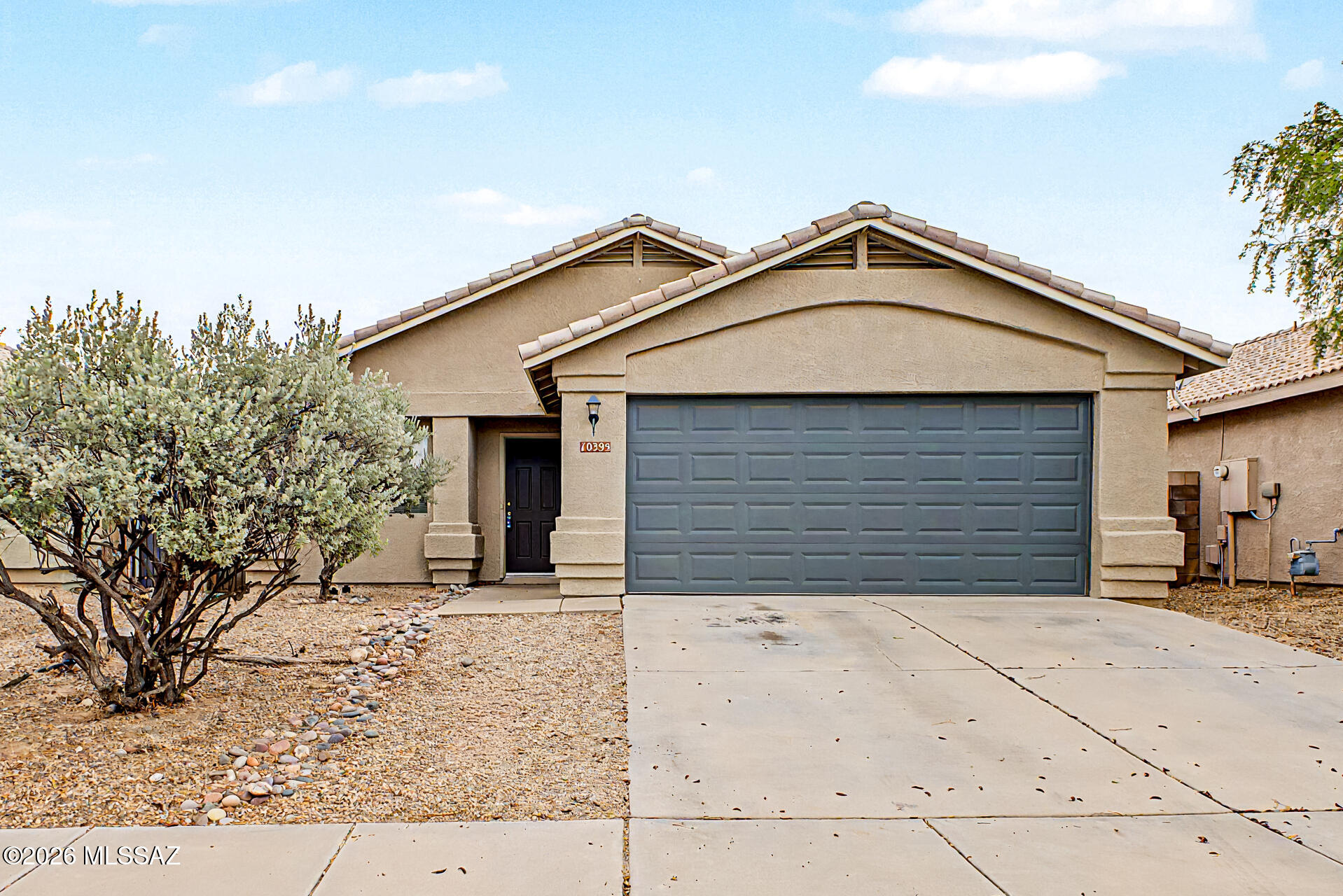 Range price; seller will counter or accept offers between $310K - $315K. Become the proud owner of this lovely 4-bedroom, 2-bath; 2 car garage in Mesquite Ranch & #1 Vail School Dist. Pool & park in walking distance from home. Living rm with high, vaulted ceilings, a soothing palette, blinds, & attractive wood-look flooring. Gather in the great room, complete with a blend of soft NEW carpeting & tile flooring. Sliding door access to the backyard for seamless indoor-outdoor flow. The well-appointed kitchen comes with ample wood cabinetry, essential built-in appliances, a pantry, & a 2-tier peninsula with a breakfast bar for quick meals. The main bedrm features a cozy sitting nook, a private bathroom with dual sinks, & a walk-in closet. Unwind on the covered patio & private backyard. Roof has been leak free & was just professionally serviced by Roof Savers 7-2026. Interior was professionally deep cleaned in 7-2026.  HVAC system just inspected and serviced by Mission Heating & Cooling in 7-2026 & is in great working order.  New light fixtures being installed by August 1, 2026.  PArk includes basketball and pool is adjacent to the park.  Sidewalks throughout the neighborhood.