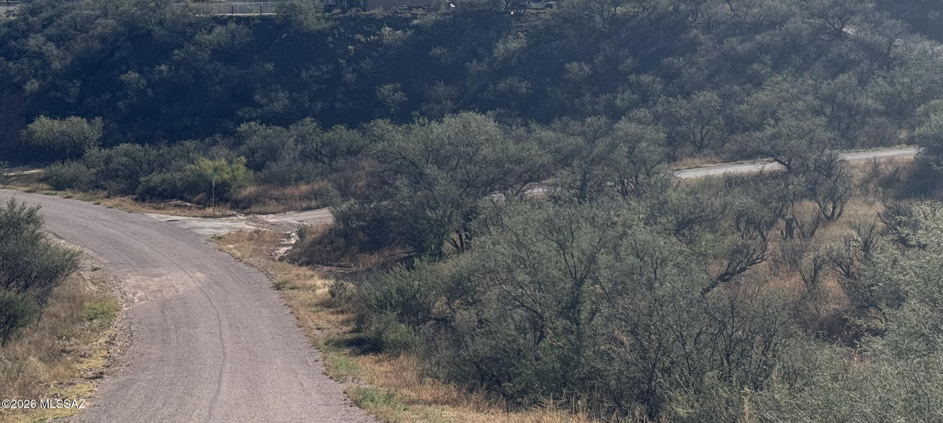 This is a corner lot in Rio Rico, Arizona situated in a quiet residential neighborhood with freeway access along with supermarket, schools, and other conveniences only minutes away.