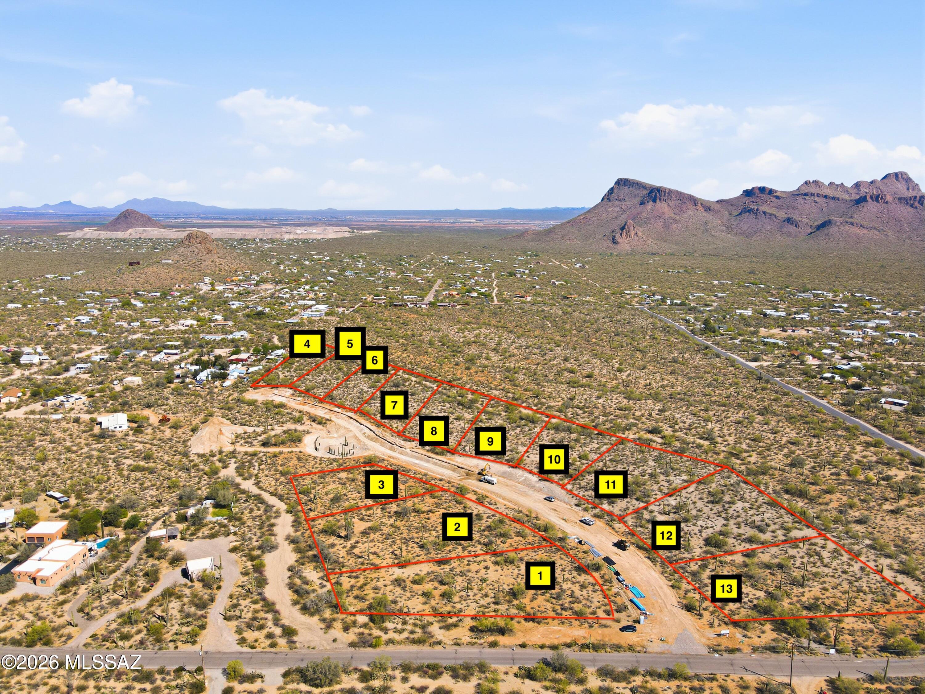 NEW CUSTOM LOT SUBDIVISION of 1+ acre lots: all with PANORAMIC mountain views. LUSH vegetation dotted with SAGUAROS and LEVEL or GENTLY SLOPED building areas. Choose RIDGETOP sites with views across Avra Valley, and the peaks of NEARBY Saguaro National Park or nestle in flat, well vegetated sites for PRIVACY.  Only 11, Phase 1 parcels available, priced from $148,000 to $164,000. Sites serviced by water, electric, phone and cable with HOA fees of only $125 per year. Single level homes required with a minimum 1800 sq. ft. and 20'  height restriction.   Choose your builder or ask about the available Dell Mar Homes models. Approx. 13 minutes west of the Ina/I-10 intersection for convenient Downtown, U of A and Airport access. Shown by appointment only during construction. CALL TODAY.