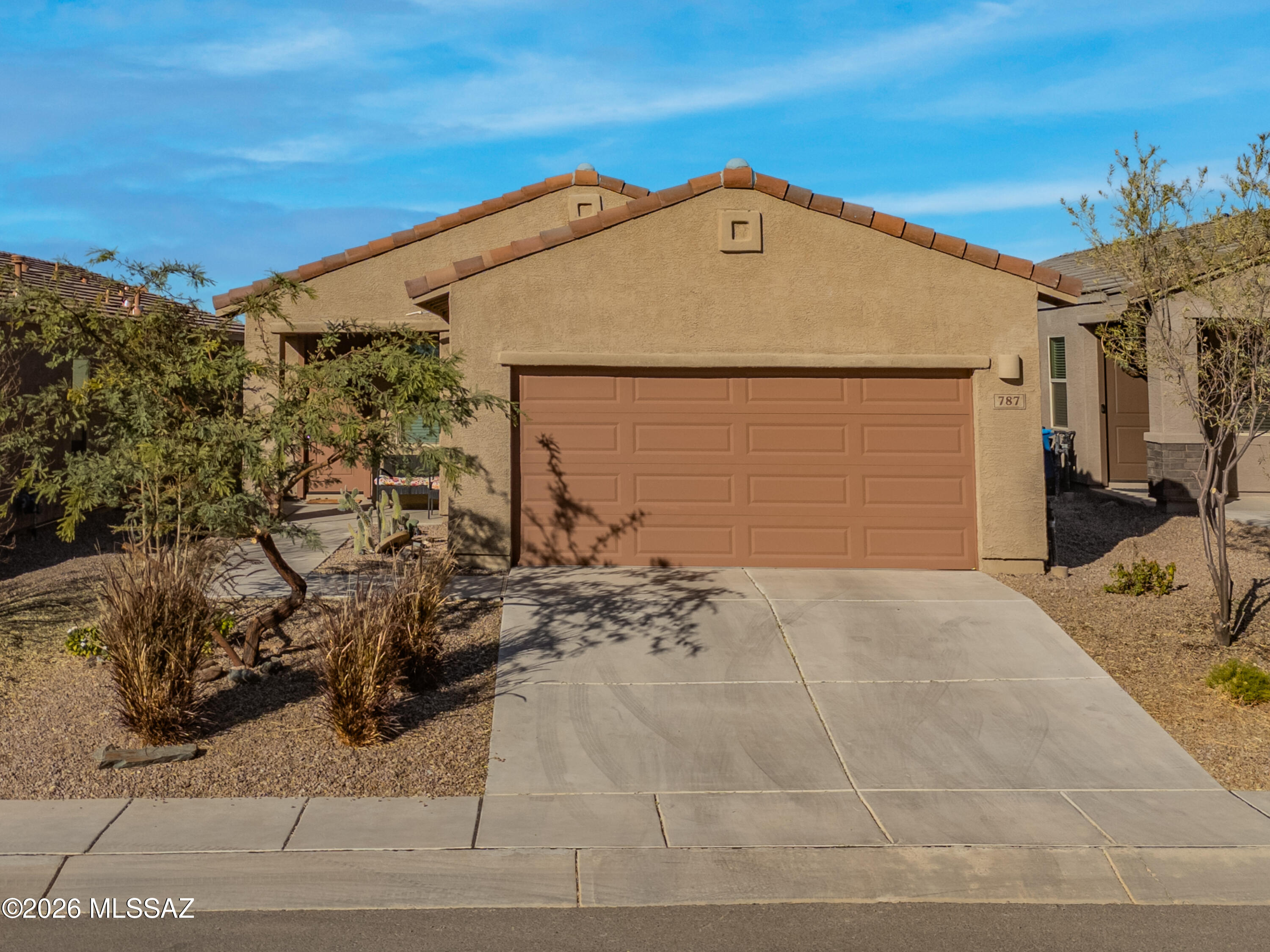Built in 2021, this beautifully maintained 3-bedroom, 2-bath home offers modern comfort and style in a desirable single-level floor plan. The open-concept living area is filled with natural light and flows seamlessly into a stunning kitchen featuring granite countertops, a large center island, stainless steel appliances, a gas range, and rich espresso cabinetry. The spacious primary suite provides a private retreat, while two additional bedrooms offer flexibility for guests, family, or a home office. Tile flooring in the main living areas, recessed lighting, and contemporary finishes add to the home's appeal. Outside, enjoy low-maintenance desert landscaping, a covered entry, and an attached 2-car garage. Move-in ready and perfect for full-time living, seasonal use, or investment.