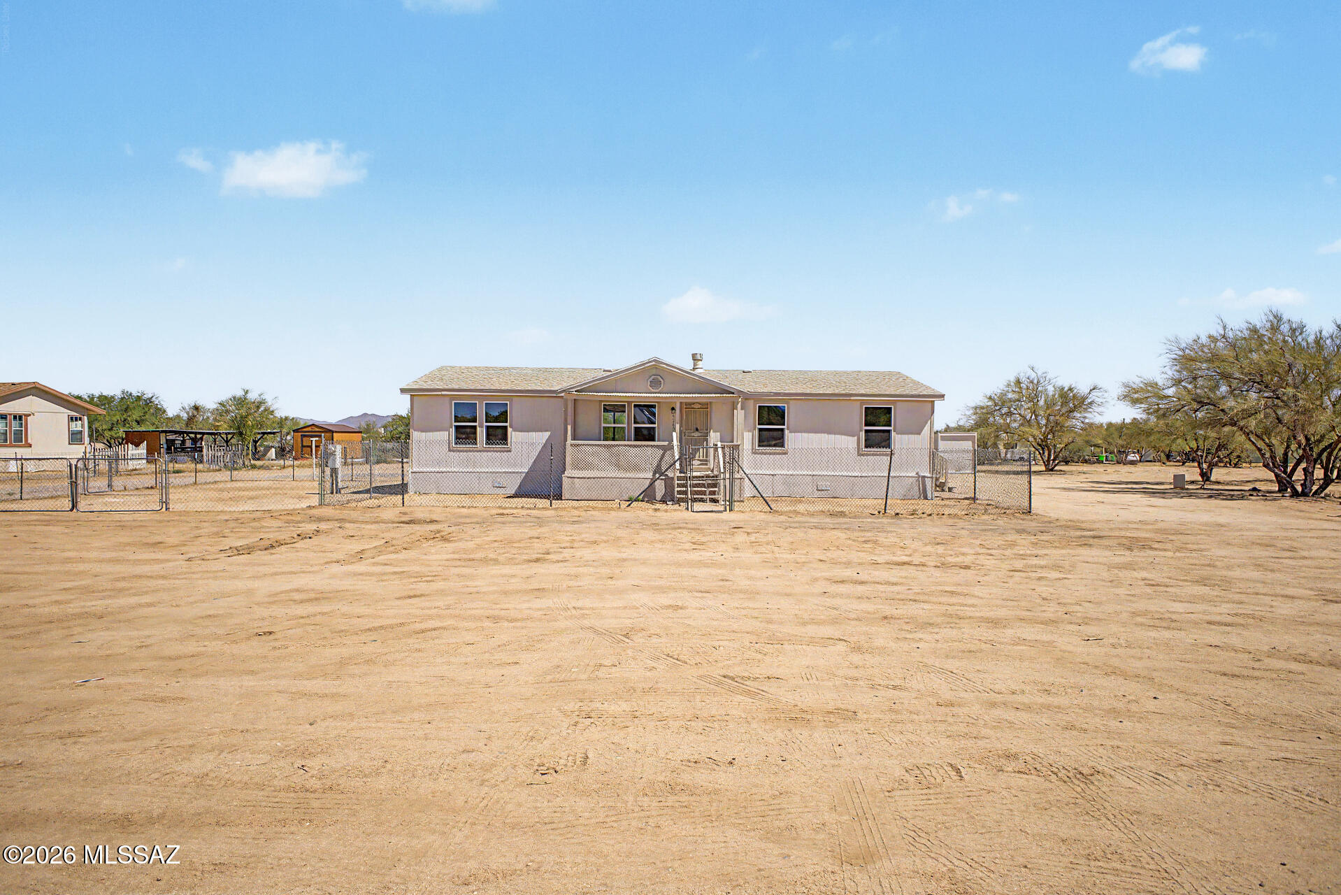 Don't miss this incredible opportunity! Situated on 2.34 acres, this beautifully updated 4-bedroom, 2-bath mobile home offers space, comfort, and endless potential for horses, RV parking, storage, or future improvements. Inside, enjoy vaulted ceilings, a cozy fireplace, fresh two-tone interior paint, new flooring throughout, dual-pane windows, and updated lighting, fans, and hardware. The remodeled kitchen features new cabinets, laminate countertops, plumbing fixtures, and stainless-steel appliances, including a propane gas stove. Both bathrooms have been refreshed with new fixtures. Additional features include PEX plumbing, copper wiring, HVAC (2024), water heater (2022), serviced roof, electric dryer hookups, and two storage sheds. Move-in ready with room to grow! Owner/Agent Out back, you'll have ample space ready for your personal touch, where you can create your perfect oasis and enjoy the serene views. Truly a must-see!