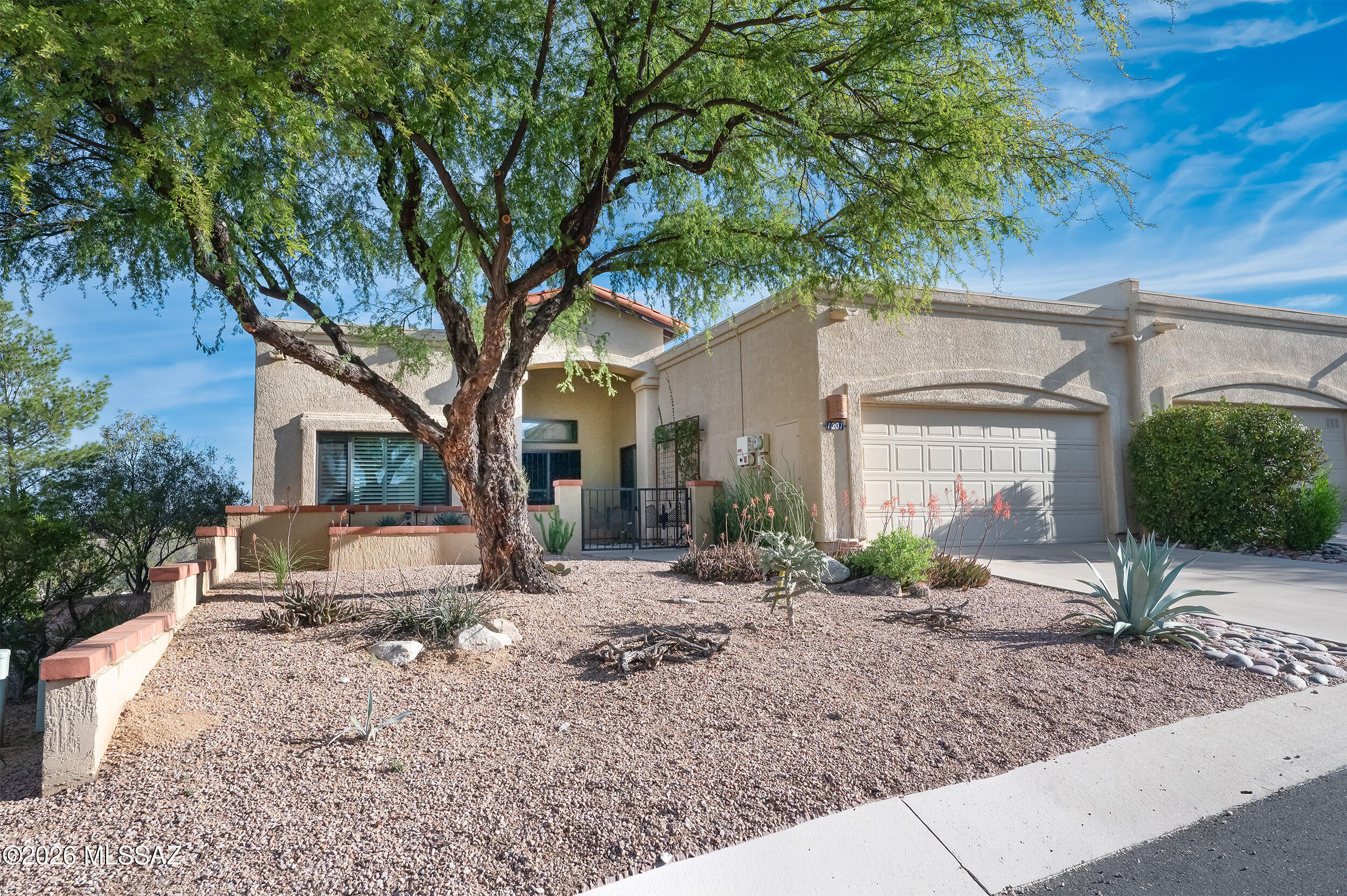 Amazing El Conquistador townhome with privacy + mt views and more. Paid Solar. This is a highly sought 3/2 (1516 sf) SW style with a 2 car garage and oversized patio. Inside SW style through-out with satillo tile. Freshly painted interior. New Fans Throuogh out. Great room plan with an impressive fireplace plus split bedrooms offer privacy and functionality. Outside the home sits on a ridge top with Oro Valley, Tortolita & Catalina Mtn views. An oversized patio with extensive brickwork makes for comfortable outdoor  living/entertaining. Garage has Electric Car Charging Station. Located in one of the most naturally beautiful parts of Arizona with easy access within Oro Valley makes  his a highly demanded home. Don't miss out and shedule an appointment today!