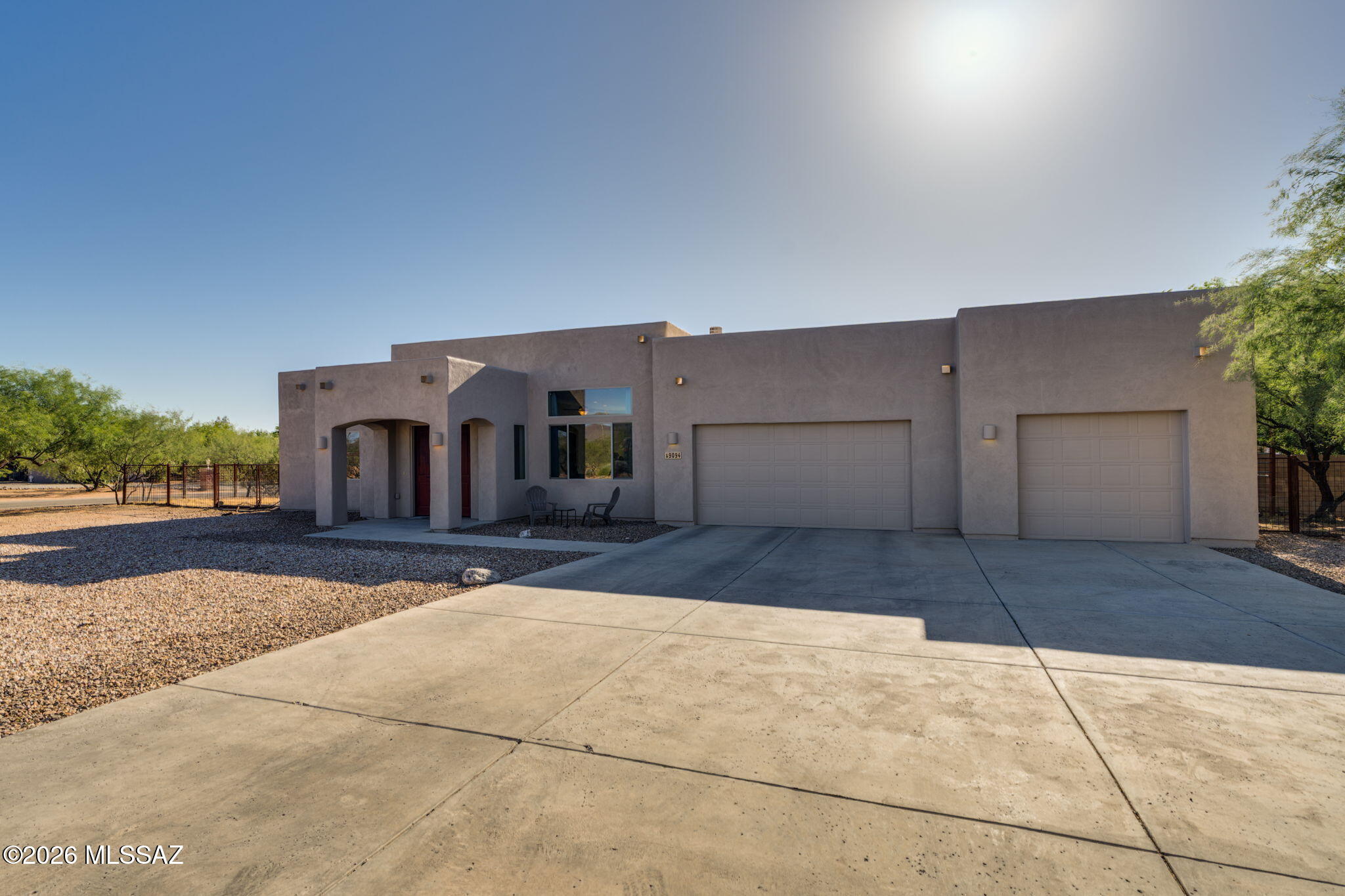 Bright and open 5-bedroom, 2.5-bath home with 2,627 sq ft on a .83-acre corner lot. Features an oversized 3-car garage, high ceilings and tile throughout main living areas. Large great room with fireplace, office/den or 5th bedroom, and laundry with extra storage cabinets. Kitchen offers granite, stainless appliances, breakfast bar and pantry. Spacious primary suite includes backyard access, dual vanities, a large shower with multiple heads plus soaking tub. Garage is wide and deep enough to fit 3 cars plus space for storage!  Enjoy your own home-grown citrus and pomegranates while relaxing in your backyard with mature trees, artificial turf and extended covered patio. Located in The Award-Winning Vail School District.