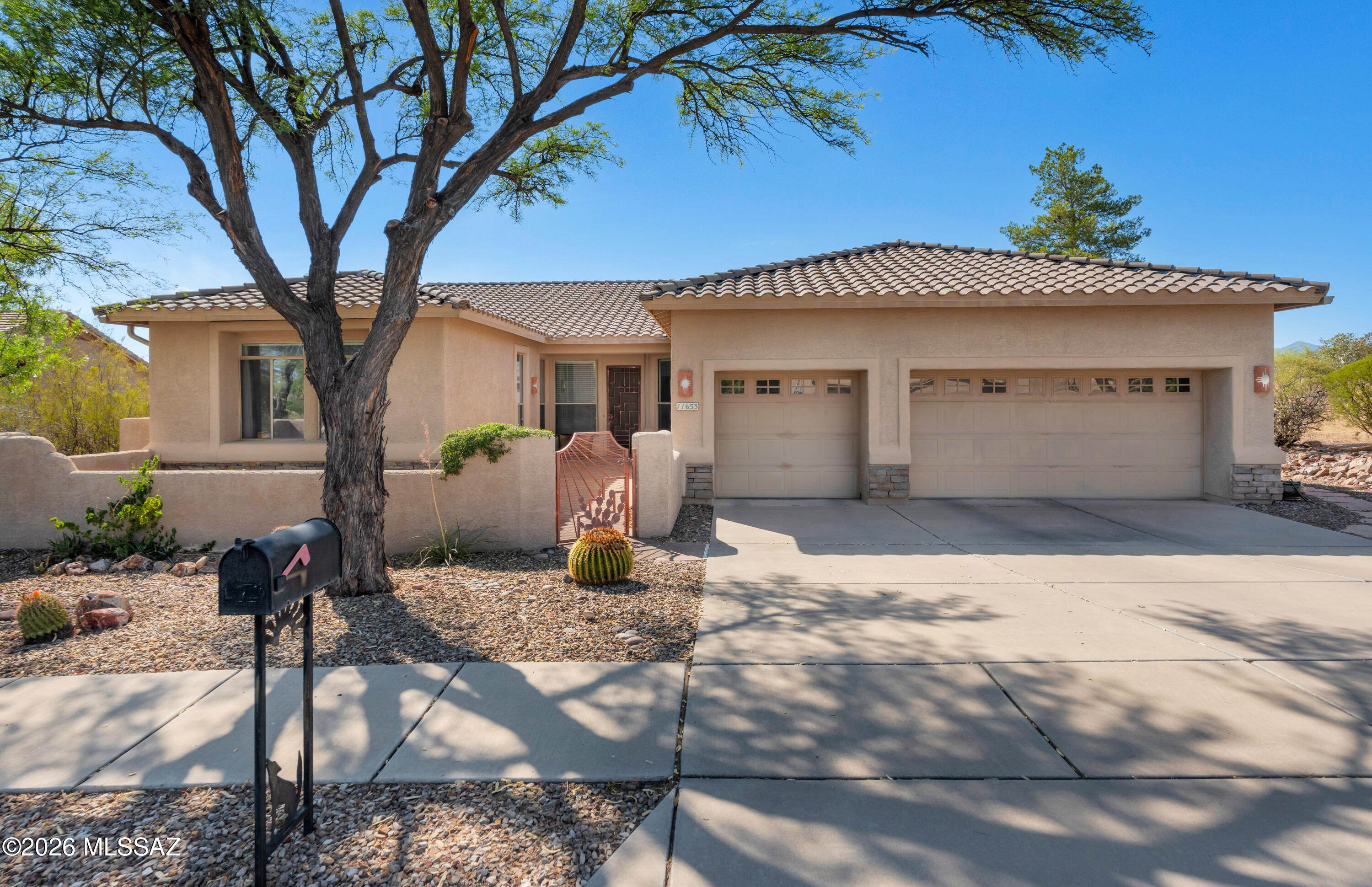 Nestled in one of Oro Valley's most desirable neighborhoods, this beautifully designed single-story home offers 2,930 square feet of spacious living with 4 bedrooms and 3 full bathrooms. The thoughtfully designed split-bedroom floor plan provides both privacy and functionality, while the expansive great room with a cozy fireplace creates the perfect gathering space. The well-appointed kitchen features abundant cabinetry, solid corian countertops and an open layout that seamlessly connects to the family room--ideal for entertaining and everyday living. The spacious primary suite is a true retreat, complete with a bay window, spa-inspired bath featuring a soaking tub and separate shower, and generous closet space. Step outside to your private backyard oasis where a sparkling pool and spa overlook a natural desert buffer, offering exceptional privacy and tranquil Arizona sunsets. Situated on a generous 0.38-acre lot, the home also includes a 3-car garage, covered patio, mature desert landscaping, and plenty of room to relax or entertain.