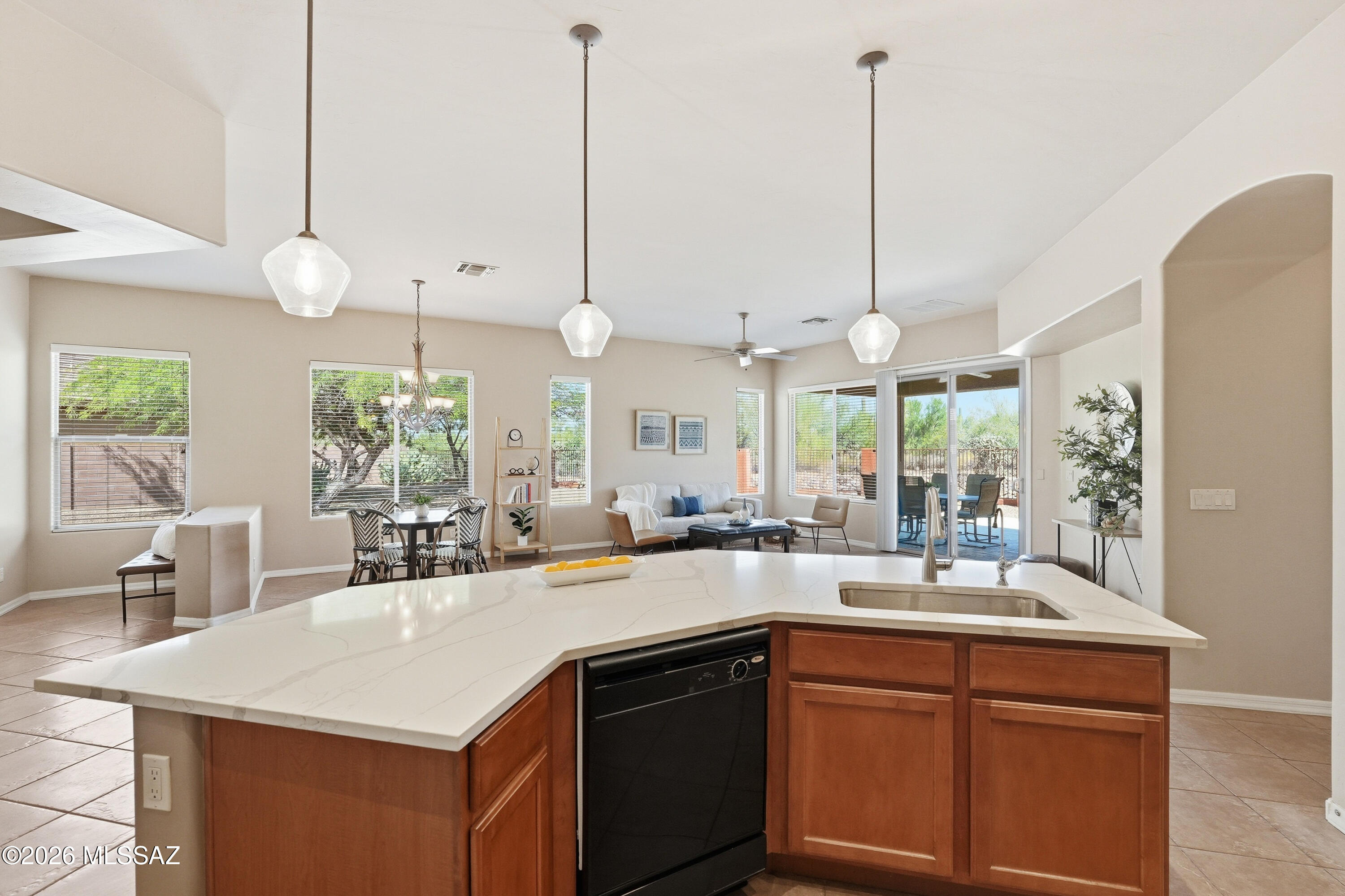 Why wait for new construction when you can have what most new homes simply can't offer? While many new construction homes are built on much smaller lots with neighbors just steps away, this property offers the space, serenity, that take years to create and 10Ks of dollars.  This exceptional 3-bedroom, Den, OR 4 bed home in the gated Preserve at Dove Mountain, perfectly situated on a rare pie-shaped ¼-acre homesite with outstanding privacy.  Inside, you'll find a bright, open floor plan with tile flooring throughout all the main living areas + Beautifully updated kitchen with quartz counters & subway tile.  View Fencing. Large covered PATIO. HVAC is only 2 years old!!  INCREDIBLE VALUE! Near Ritz and Gallery for memberships, Maranas New Splash Pad and STEM School.