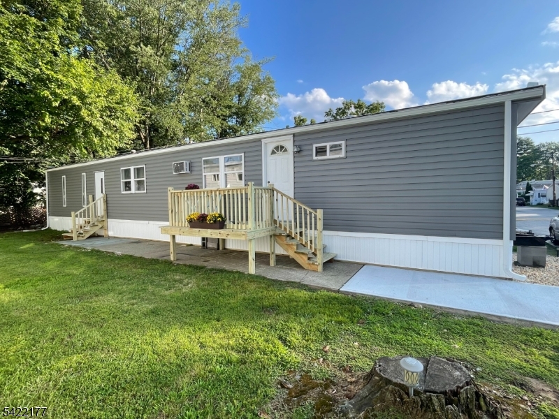 New opportunity to own vs rent in Wayne's desirable Finns Mobile Home Park.  This 2 bedroom ,1 & 1/2 bath home was renovated in 2023.Newer luxury vinyl plank floors, crown molding and baseboards. Enter into the living room, with a good-sized bedroom to your right. To your left is the dining area / eat in kitchen depending on how you set it up. Continue down the hallway, pass the half bath on your right and second exit on your left.  Straight ahead is the primary bedroom with ensuite full bath.  Enjoy the warmer weather seated on the newer deck. Great opportunity to fence in the amply yard for private outdoor space. Conveniently located close to shopping, restaurants, etc. Monthly fee includes lot rent, water, garbage, septic, plowing and maintenance of common areas. Potential buyers must fill out community application and be approved before an offer can be accepted. Current NTN required.  Cash preferred / mortgage company information available.