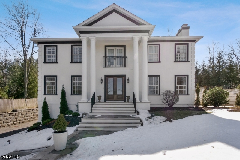 Entertainer's Dream! Modern & light filled 7 Bdrm all ensuite custom Colonial located on a quiet street in the Deerfield section w/private yard, large patio & rm for a pool. 1st fl with fabulous flow. Grand foyer. LR w/ frpl & stunning views at sunset leading to DR w/ coffered ceilings, dark wd flrs & oversized windows.  Chef's EIK w/huge Pantry, granite countertops & high-end appliances leads to adjacent Family Rm w/frpl & custom wet bar. Both rms have French sliders to the oversized patio overlooking the backyard.  1st fl also w/Guest bdrm/Office ensuite. Exceptional Primary suite w/gas frpl, huge WIC, & spa-like bath, & 4 additional spacious ensuite Bdrms plus Laundry Rm all on the 2nd fl! Lower Level includes a tremendous Rec Rm perfect for indoor play w/a Guest Suite & access to the 3-car garage.