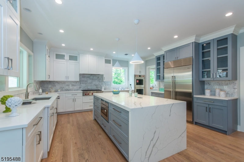 Owner's rep listed below. Brand new construction! Welcome to your exquisite, bespoke home nestled against the scenic South Mountain Reservation, boasting breathtaking vistas of New York City! Whether you work remotely or commute to the city, you can easily access the train station for a quick 40-minute ride. This residence offers a peaceful, charming ambiance, with five generously sized bedrooms, five full bathrooms, and one half bath, providing abundant space for all occupants. The first floor boasts a gourmet kitchen with Butler's pantry, perfect for whipping up delicious meals, and the family room is steps away. Perfect for those dinner parties and the overflow! The oversized living room and dining room are ready for entertaining. The sunlit first floor office has a fireplace that is open to the living room. The guest bedroom suite completes this floor. The second floor is a true oasis, featuring an oversized owner suite with two dressing rooms and a full bath complete with a jetted tub and separate shower. The second floor also has 3 more bedrooms, with 2 additional bathrooms, providing plenty of space and privacy for everyone. The Lower level is where you will find the 3 car garage, rec room and full bath. This home truly has it all - luxurious finishes, ample space, stunning views, and a prime location. Don't miss out on the opportunity to make this spectacular home yours!