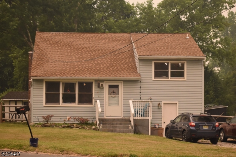 Come see this updated 4 BR 2 BTH split level home on corner lot in a quiet neighborhood with a nice size level fenced backyard, hardwood floors, renovated eat-in kitchen w/ separate dining area. LL has a family Room w/ walkout to backyard, Laundry Room, basement, 1 BR w full bath, storage. Newer septic, newer roof, newer furnace. Extra flooring/tiles stay if buyer wishes to finish LL with it. Swingset stays along with patio furniture, grill, fridge in basement.  Window AC units neg.