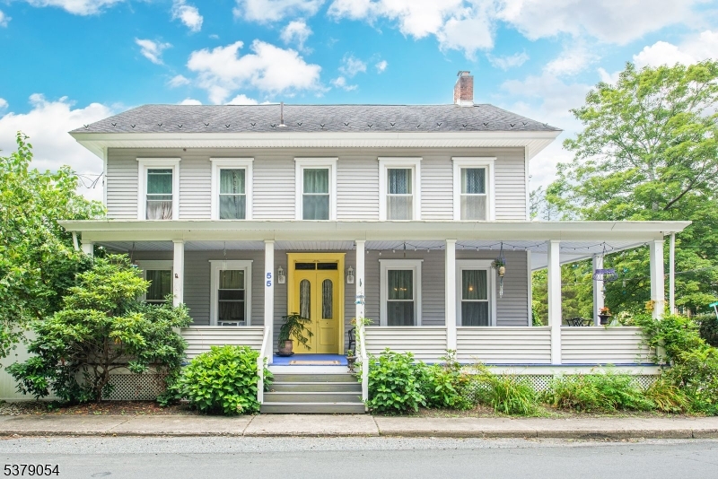 A rare chance to own a piece of history reimagined for modern living. This storybook 4-bedroom home blends original character with thoughtful updates, creating a space that feels both timeless and move-in ready.  From the moment you arrive, the wraparound front porch sets the tone perfect for morning coffee, remote work sessions, or winding down at the end of the day. Inside, you'll find generously sized rooms, warm wood floors, and original trim that deliver authentic charm you simply can't replicate.Major updates including siding, windows, septic, and well offer peace of mind, while the 1st floor renovated bathroom strikes the perfect balance of style and function with a vintage clawfoot tub and separate walk-in shower.  The layout supports today's lifestyle with a spacious kitchen that opens to a fenced backyard and patio for easy indoor-outdoor living, a formal dining room for hosting, main-level laundry, and a flexible second-floor office or guest space ideal for working from home or creating a dedicated studio.Need more space? The full walk-up attic offers endless potential for a home gym, creative space, or additional living area. Parking for up to 8 cars and the oversized pole barn with loft provide incredible bonus space for hobbies, storage, or even a workshop setup. Less than an hour from NYC, this home offers both convenience and lifestyle with quick access to restaurants, shopping and all  recreational opportunities that the Delaware River region has to offer.