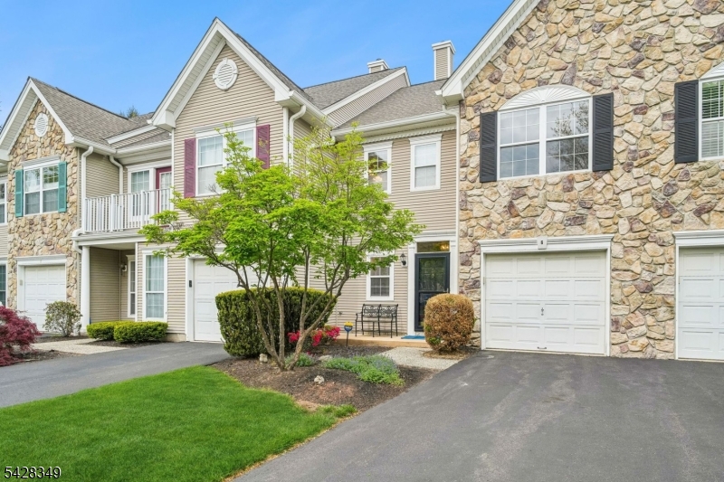 NEW PRICE!Light and bright 2 BR, 2.1 bath condo in highly sought after Hamilton Crest neighborhood of The Hills. Freshly painted and ready to move right in! Hardwood floors in Foyer lead to a formal dining room with chair rail molding and opens to dramatic living room with soaring ceiling and two-story gas fireplace flanked by arched windows. The eat in kitchen has white cabinetry and appliances including refrigerator, dishwasher, range with gas cooktop & microwave.Double glass sliding doors bring in abundant natural light and leads to a spacious, private fenced patio perfect for summer BBQs and year round entertaining.The second level of the home presents the primary bedroom with a cathedral ceiling, large walk in closet and en-suite bath featuring a jetted tub, separate shower and double sinks. The second bedroom is generously sized and has a double closet with mirrored doors. The hall bath has neutral tile and shower over the tub.  Conveniently located on this level is an upstairs laundry room w/washer and dryer. The location of this home can't be beat! Grab your morning coffee at nearby Dunkin! Pick up dinner on the way home! This home offers the best in city to suburban lifestyle amenities including the community pool,tennis and clubhouse and the award winning Ridge High School.
