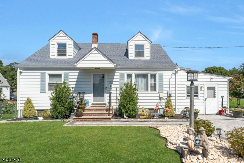 Move-In Ready Cape Cod with Modern Updates & Prime Location! Offers the perfect combination of charm, space, and convenience. Situated on a large corner lot with professional landscaping and outstanding curb appeal, this home features 3+ bedrooms, 2 full baths, and flexible living spaces throughout.The main level boasts an open-concept layout with an updated eat-in kitchen featuring quartz countertops, stainless steel appliances, a breakfast area, and dining space that flows seamlessly into the bright and spacious living room. Two bedrooms and a full bath complete the first floor.A converted garage provides a versatile bonus room that can be used as a family room, home gym, playroom, or additional storage. Upstairs, you'll find a spacious bedroom, a full bath, The finished basement offers a recreation room and direct access to the backyard. Major updates completed in 2022 include a newer roof, windows, HVAC system, kitchen, upgraded electrical and plumbing. A new furnace and water heater were installed in 2026.Enjoy outdoor living in the fenced backyard featuring a patio and lawn area, perfect for entertaining. A brand-new driveway and sidewalk provide parking for 4+ vehicles.Conveniently located near parks, schools, shopping, dining, Route 22, the NJ Turnpike, Garden State Parkway, public transportation to NYC, and Newark Airport.