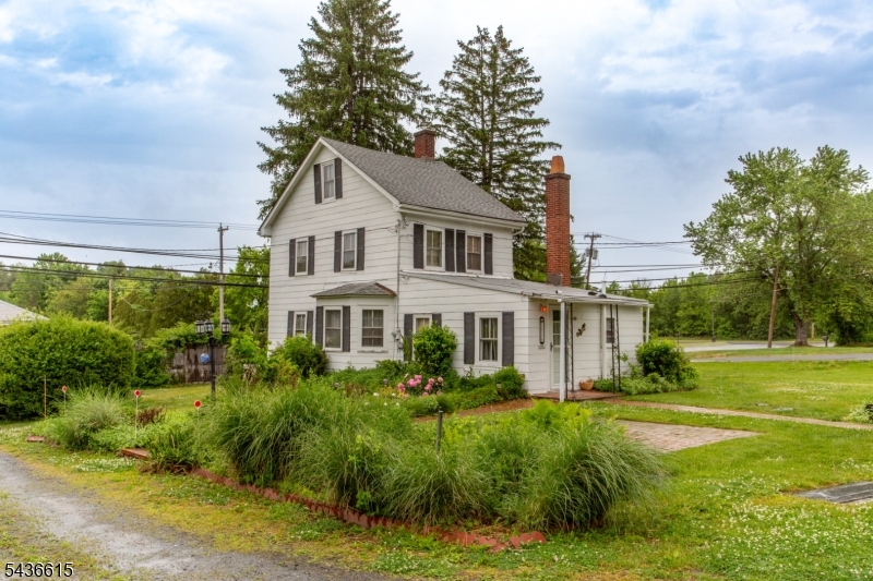 Set on approximately 1.5 acres just minutes from the heart of Lambertville, 1510 Route 179 offers a rare blend of residential charm and commercial potential. Currently utilized as a private residence, this classic 2-bedroom, 1-bath farmhouse is also commercially zoned, presenting a unique opportunity for entrepreneurs, investors, or buyers seeking a live-work property in a highly desirable Hunterdon County location.With 1,077 square feet of living space, the home showcases timeless farmhouse character, including original wood floors, period millwork, and a traditional floor plan that reflects its historic roots. The inviting living and dining areas provide comfortable everyday living, while the kitchen offers convenient access to the backyard, creating a seamless connection between indoor and outdoor spaces.Upstairs, two generously sized bedrooms are bathed in natural light and enjoy views of the surrounding property, offering a peaceful retreat that feels worlds away while remaining just minutes from Lambertville's acclaimed restaurants, boutiques, galleries, and everyday conveniences.Outside, the expansive grounds provide ample space for gardening, recreation, future improvements, or potential business-related uses. A separate woodshop/workspace adds valuable flexibility, ideal for artisans, hobbyists, storage, or small-scale commercial operations.