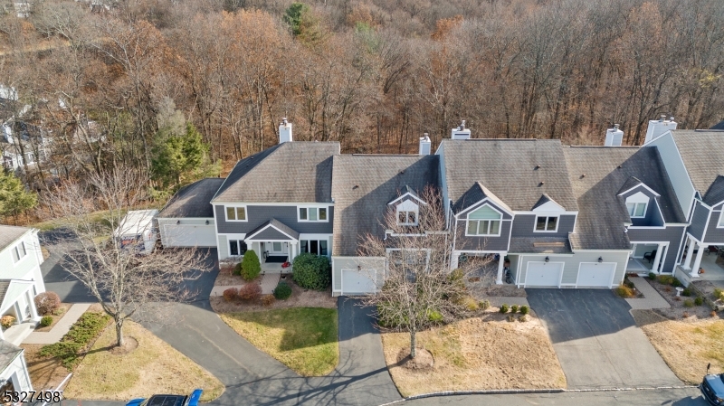 Experience this beautifully appointed 2 Bedroom, 2.5 Bathroom Townhome located in Greentree Village, a 24/7 Gated Community in Sparta NJ with unparalleled amenities. This is a "must see" if you're looking for a safe & peaceful environment. Upon entry you are greeted by an Open-Concept Floor Plan with oversized windows, sliding doors, and skylights showering this Unit with natural light. The First Floor features a soaring 2-Story vaulted ceiling Living Room with a warm and cozy natural gas Fireplace, an Eat-In Kitchen with Breakfast Bar including Granite Countertops, custom Backsplash & Stainless Steel Appliances, a separate Formal Dining Room, and Powder Room. On the Second Floor you will find 2 spacious Bedrooms and 2 Full Baths including a Primary Bedroom with an En-Suite Bathroom with Dual-Vanity Sink, Stall Shower, Walk-In Closet and your own private Balcony Deck that looks over a peaceful ravine. The Full Unfinished Basement has high ceilings and is your canvas awaiting your creativity. Recent upgrades include conversion to natural gas, a new furnace, water heater, air conditioning, fireplace insert, kitchen upgrades, new washer and dryer, new garage door & a porch resurface. Greentree Village offers a Swimming Pool, Tennis Courts & Clubhouse. SPARTA OFFERS THE #1 SCHOOL SYSTEM in Sussex County. Close by the renowned Crystal Springs & Mountain Creek Resorts offering a Ski Resort, Waterpark, Mountain Bike mountain, 7 premier Golf Courses, Top-Rated Dining & much more!