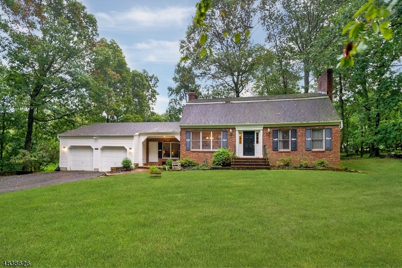 Gorgeous custom built colonial on beautiful 2.11 acre lot on quiet country road!  This warm & inviting home offers formal LR & DR with gorgeous hardwood floors & natural trim, spacious kitchen with center island & eating area that opens to the family room with high ceilings, brick fireplace, 1st floor bedroom & full bath as well as laundry room.  Second floor features a private master bedroom, walk in closet & luxury bath, 2 additional spacious bedrooms & main bath.  Amenities include gorgeous hardwood floors, wonderful natural light, privacy galore, serene pastoral setting & so much more.  Close to highways, transportation schools, shopping & more.