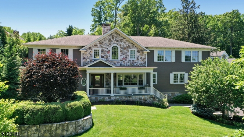 This magnificent 2009 Custom built home offers 5 bedrooms and 5.1 baths. Due to its unique flexible floorplan, this home is sure to suit your every need. Enter the home and take in the grand foyer w/ powder room and closet. The chef's kitchen overlooks the Fam Room with 22' ceiling & stone fp.  A formal dining area leads to an elegant formal living room and private office/library with fp.  The 1st Fl primary suite with fp, dual baths, and closets, is opulent. Oversized windows showcase the view to the terraced gardens & patio/bar area w/ large hot tub. The 2nd floor includes a private office with french doors, four large BRs (two connected by a full bath, and one with a private bath & a 2nd laundry). The lower level offers a mudroom w/ built-ins, rec room, full bath, wine storage, laundry, and garage access.