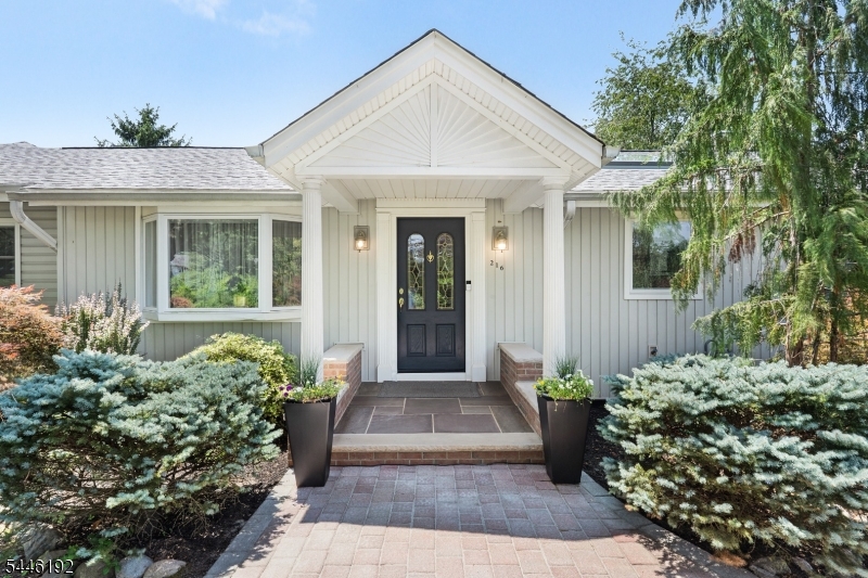 Completely renovated ranch set on 1.5 acres of meticulously landscaped, park-like grounds. This spacious and airy home features vaulted ceilings in the living room, primary bedroom, and family room, creating an open and inviting atmosphere. The oversized primary suite offers a full en-suite bath and a walk-in closet. The second bedroom also features its own en-suite bath, providing comfort and privacy for guests. A partially finished walkout basement is perfect for entertaining or additional living space. Step outside to the paved patio and enjoy the serene, quiet setting surrounded by beautifully maintained landscaping. Additional highlights include a new roof, paved patio, and exceptional indoor and outdoor living spaces in a peaceful, picturesque location.