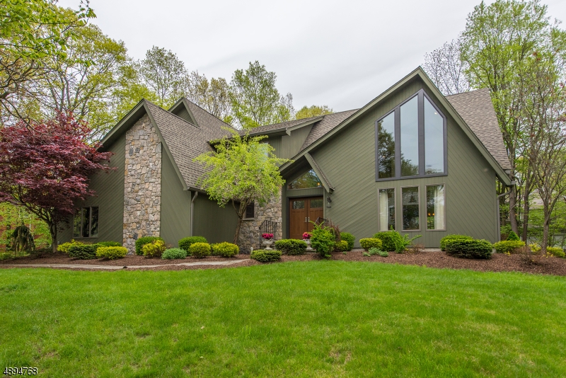 This custom home is nestled next to Malon Dickinson Reservation-3500 acres of parkland & some of Sparta's premier real estate Designed to bring in nature &  light w/ volume ceilings, walls of windows & wooded boarders. The home stands the test of time with clean lines, a neutral pallet and updated kitchen and baths. Meticulously maintained: 2015 furnace, CA, roof, wood-burning stove, kitchen and deck remodel, custom closets and office organizational systems. Indulge in your master suite with 2 custom WICs, jetted tub, dual vanity  & stall shower. 1st fl library with adjoining bath, family rm with stone FP,formal living & dining rms, laundry and powder room. Finished  1893' basement offers recreation, fitness and hobby spaces. Move-in w/ confidence to this immaculate home. BACK UP OFFERS ONLY