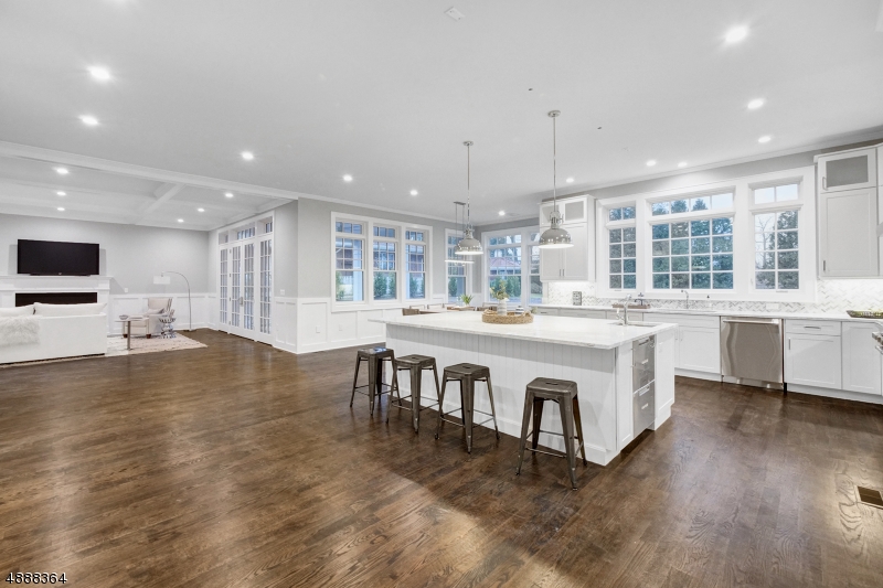 Spectacular New Construction Center Hall Colonial, set majestically on 3/4 of an acre of gorgeous property on a prestigious street in Old Short Hills, w/ plenty of room for a pool! This stunning home features a dramatic 2-story entrance foyer, radiant heated floors in master bath, 10' ceilings on the 1st level & 9' ceilings on the 2nd level. Ideal flow, perfect for grand entertaining, for an easy & sophisticated lifestyle. Guest bedroom suite on 1st level. 2nd level boasts Master Suite with 2 walk-in closets, spa-like master bath with radiant heated floors & 4 additional bedrooms, all en suite. This stunning home is pre-wired with Smart Home Technology & pre-wired for a generator. Top craftsmanship from a well respected builder in the perfect Short Hills location in highly rated Hartshorn Elementary district!