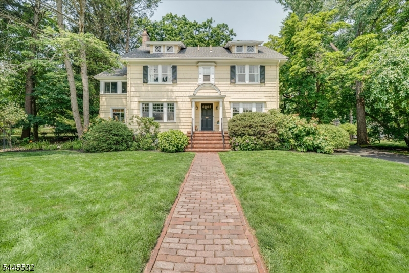 Perfectly positioned across from a picturesque park, this classic Center Hall Colonial offers timeless architecture, generous living spaces, and an exceptional South Orange location. With 6 bedrooms, 3 and a half baths, and three finished levels, this gracious home blends historic charm with thoughtful updates designed for today's lifestyle.A welcoming foyer introduces beautifully scaled rooms highlighted by soaring ceilings, abundant natural light, and a wood-burning fireplace that anchors the inviting living room. The renovated eat-in kitchen serves as the heart of the home, seamlessly supporting both everyday living and entertaining, while updated bathroom and a newer driveway add modern comfort and convenience.Six spacious bedrooms are thoughtfully distributed across the second and third floors, offering flexibility for guests, home offices, or extra living space. A charming 2nd-floor porch provides the perfect spot to enjoy morning coffee or unwind while overlooking the park.The lower level offers abundant storage and the opportunity to create additional living space tailored to your needs. Outside, enjoy a private yard in one of South Orange's most desirable neighborhoods, just moments from vibrant downtown shops, restaurants, parks, and Midtown Direct trains to New York City.Rich in character, generous in scale, and ideally situated, 209 Grove Rd presents a rare opportunity to own a distinguished home where classic elegance and everyday convenience come together.