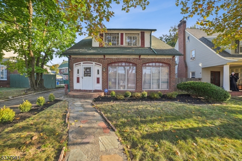 Back on the market?your opportunity awaits for this charming 4-bedroom, 2.5-bath colonial nestled in Newark's historic Weequahic neighborhood. Listed on the city's historic registry, this home exudes timeless character and offers incredible potential. Step inside to find original wood floors hidden beneath the carpets, French doors, and a high mantle wood-burning fireplace adding elegance to the formal living room. Adjacent, a formal dining room awaits, perfect for hosting gatherings and creating lasting memories. The foyer and California/3-season rooms feature floor-to-ceiling jalousie windows, flooding the space with natural light. The 1st floor bedroom or den, complete with easy access to a full bath, is perfect for multi-generational living. The kitchen features stainless steel countertops and appliances, ready to be restored to their full glory. Upstairs, three spacious bedrooms boast double cedar closets, offering ample storage. The finished basement adds versatility for a recreation room, laundry area, and workshop, while the detached two-car garage and mudroom add practicality. While the home requires updates, it's an ideal candidate for a 203K or renovation loan, allowing you to bring your vision to life. With its historic charm, spacious layout, and unique details, this property offers the perfect opportunity to create the home of your dreams. Great news: the oil tank has been removed with no environmental issues.Don't miss the chance to restore a piece of history!
