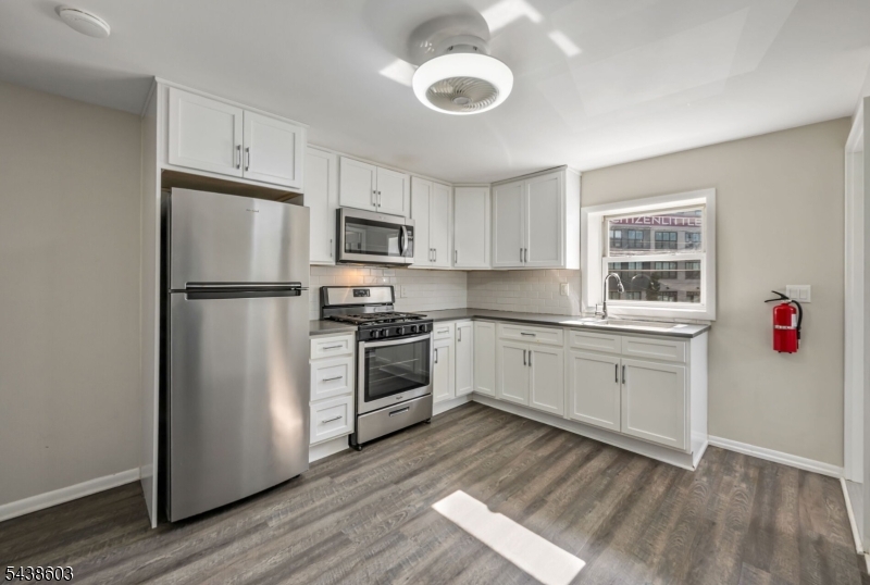 Welcome to this beautifully renovated 2-bedroom, 1-bath second-floor apartment in the heart of Little Falls. This bright and inviting home features an updated kitchen with stainless steel appliances, modern finishes, luxury vinyl flooring and the convenience of in-unit laundry. Enjoy a shared parking lot and a thoughtfully designed layout offering comfortable living and ample natural light throughout. Ideally located near NYC-bound transportation, shopping centers, restaurants, parks, and recreational amenities. Commuters will appreciate easy access to major North Jersey highways, making travel throughout the region simple and convenient. Don't miss this opportunity to enjoy modern living in a prime location close to everything Little Falls has to offer. Landlord requires a short term lease with auto-renewals.