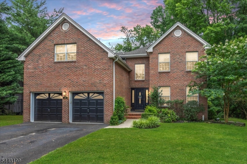 Nestled on over 2.5 private acres at the bend of a quiet street, this stately brick-front Colonial offers the perfect blend of timeless elegance, generous living space, and modern comfort. A dramatic two-story entry foyer welcomes you into this beautifully maintained home, featuring hardwood floors throughout the formal living and dining rooms. The spacious kitchen is designed for everyday living and entertaining, complete with a center island, sunny breakfast area, and seamless flow into the inviting family room with a cozy gas fireplace. Sliding doors lead to a private deck overlooking the expansive backyard, creating the ideal setting for outdoor dining, relaxing, or enjoying the peaceful surroundings.a tucked-away first-floor office provides the perfect work-from-home space and can easily serve as a guest bedroom. A powder room and convenient first-floor laundry complete the main level. Freshly painted throughout, the home offers a bright, move-in-ready interior.Upstairs, the primary suite features two walk-in closets and a spacious ensuite bath. 3 additional generously sized bedrooms and a full hall bath provide ample space for your guests. The finished basement expands the home's living space with endless possibilities, including areas for recreation, fitness, media, or hobbies. A bonus room offers flexible use as a guest room, home office, or additional living space, while a full bathroom adds convenience and versatility.