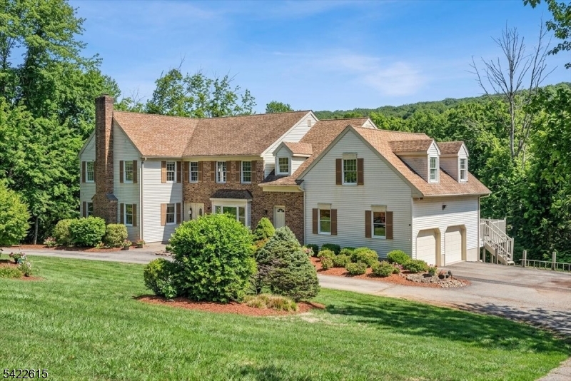 Stately 4-5 Bedroom, 3 Full Bath Newer Center Hall Colonial Situated On A Quiet Residential Cul-De-Sac, Set On A Very Private 3-Acre Property. This Impressive 3,642 Sq. Ft. Home Features A Thoughtfully Designed Floor Plan, Highlighted By A Grand Entry Foyer And A Spacious Eat-In Kit. The FR Offers A Gas FP, Soaring Vaulted Ceilings w/Sliding Doors From Both The Kitchen And FR Leading To An Expansive 50-Foot Composite Deck Overlooking A Serene, Super Private Backyard.The Main Level Also Includes a Formal LR w/a Wood-Burning FP, a Large Formal DR + a Full Bath w/Adjacent Office, There is Also a Large Mudroom Provide Additional Convenience w/Direct Access To An Oversized Two-Car Attached Garage Featuring Tons of Extra Storage Space + a Separate Staircase Leading To A Private Second-Level 26' X 21' Bonus/Playroom w/Attractive Beamed Ceiling. An Elegant Open Staircase Leads to the 2nd Floor, Which Includes 4 BR's a Large Bonus Rm a Spacious Primary Suite Complete w/2-Walk-In Closets and a Beautifully Updated Bath Featuring An Oversized Shower, Soaking-Tub, Double Sinks, High Ceilings w/Skylight. Additional Highlights Include a Partially Finished Full Walk-Out Basement w/a Custom Bar Area, Brand New Septic System (2019), Newer 2-Zone Gas Heat & CAC & 22KW Whole-House Gas Generator. Hardwood Flooring Runs Thru-Out The Home, Complemented By a Convenient Circular Driveway w/Extra Parking Space  & Located In A Desirable Neighborhood Within A Top-Rated, Blue Ribbon School District.