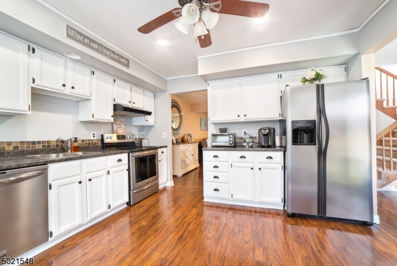 Beautifully updated 3 bed 1.5 bath Rare End unit in desirable Rolling Hills. Large bright kitchen, cherry floors, formal dining room, spacious bedrooms and finished basement for extra living space. Head off the living room out the sliders to your own deck for entertaining. Rolling hills amenities include Pool, Tennis Court, Basketball court, Playground and clubhouse.