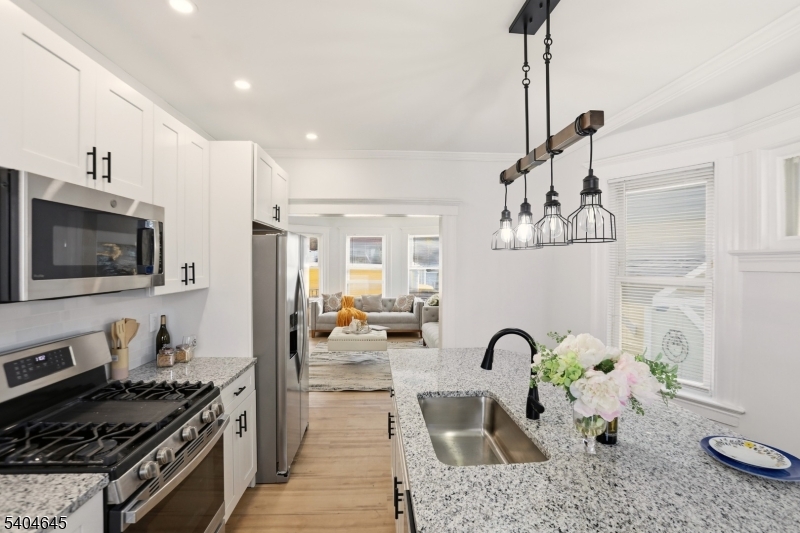 Qualifies for $22K Grant at 5.6% or  a loan with 5.1% and no PMI Seller concession $5000 if closed by 3/31/2025! Renovated Spacious 5-bedroom, 1.5-bath home ideally located just steps from the Glen Ridge border.  This property offers a large, sun-filled living room, a separate dining room, and generously sized bedrooms providing flexible living options.The Brand New Kitchen Features an expansive island and stainless steel appliancesThe full basement features an unfinished half bath, Laundry hookups, and expansive open space perfect for storage or future customization. With solid layout, abundant square footage, and endless potential, this home is ideal for buyers looking for space, beauty, and options. Conveniently located near transportation, shopping, schools, and major commuter routes.A rare opportunity in a sought-after location come make it your home. Qualifies for $22K Grant and a loan with 5.1% no PMI