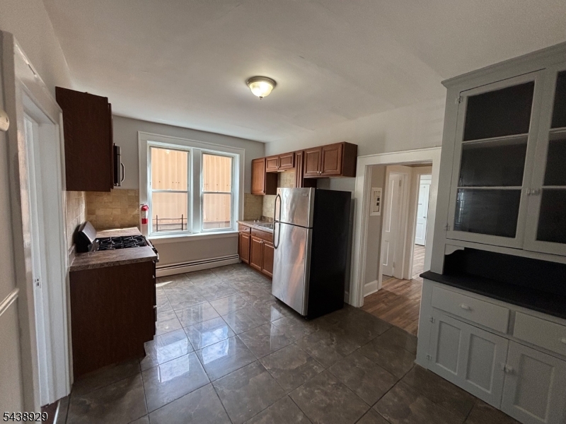 Newly renovated 2ND floor apartment that is fully updated kitchen with new cabinets and ss appliances, up dated bathroom new floors thru out this apartment. abundant amount of natural sunlight. Near by shops, transpiration, restaurants. Tenant Pays 1st $100 of repairs after the 1st month.