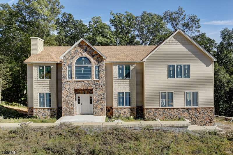 Stunning new construction. Double story foyer and hardwood floors on first level, fireplace in family room, Open kitchen and great room, perfect for entertaining. Bedroom and full bath on 1st floor. Over 4,400 square feet. This home had 4 full baths with a Jack and Jill upstairs. Amazing floor plan. Ready to pick your own colors and customize. High ceilings in basement and sliding glass doors to outside. The pictures on line are for the home next door. Arches are an upgrade. 9 Lots left from over 20 lot subdivision. Puddingstone has 2 cul de sac streets.