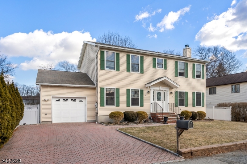 Welcome to this well-maintained Colonial-style home in one of Denville's most desirable lake communities, located on North Shore Road. This home offers a bright, open layout with great natural light throughout. The living area flows right into the dining space and kitchen, making it easy for everyday living and entertaining. Featuring 4 bedrooms and 2.5 bathrooms, the layout is both functional and comfortable. The family room features a wood-burning fireplace, creating a warm and inviting space to relax. Step outside to a fenced private yard, perfect for relaxing, hosting, or just enjoying your own space. Just moments from the lake, you get to enjoy the lifestyle that comes with it, scenery, activities, and that peaceful neighborhood feel. Close to downtown Denville, shopping, restaurants, parks, and major highways. Convenience + location all in one. This is a solid opportunity to own in a great area, don't miss it.