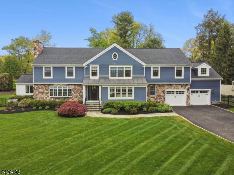 Nestled on a beautifully landscaped half-acre in the highly desirable Rolling Hill neighborhood of Chatham, this 5-bedroom, 3.5-bath residence offers a refined blend of timeless design and relaxed resort-style living. A comprehensive 2022 renovation by Lyons McConnell Architecture expanded the home with meticulous craftsmanship and elevated finishes throughout the kitchen, breakfast area, laundry room, and mudroom. The gourmet kitchen serves as the centerpiece of the home, appointed with premium Sub-Zero, Wolf, and Miele appliances, custom cabinetry, quartz countertops and designer tile and lighting. The elegant main level features, a living room, formal dining room with gas fireplace, cozy family room, and a sun-drenched office/sunroom. Upstairs, the private primary suite is a tranquil retreat with a spa-inspired bath and an oversized walk-in closet. Four additional generously sized bedrooms and a fully renovated hall bath complete the second level. The finished lower level extends the living space with a recreation room, full bath, and a versatile bonus room with an ample closet.The backyard is a picture-perfect sanctuary, featuring a bluestone patio, circular fire pit, mature plantings, private fenced yard, and expansive lawn, creating the perfect backdrop for indoor-outdoor living. Located close to top-rated schools, a charming downtown, and direct NYC train access, this exceptional home offers the ideal blend of sophistication, comfort, and convenience.