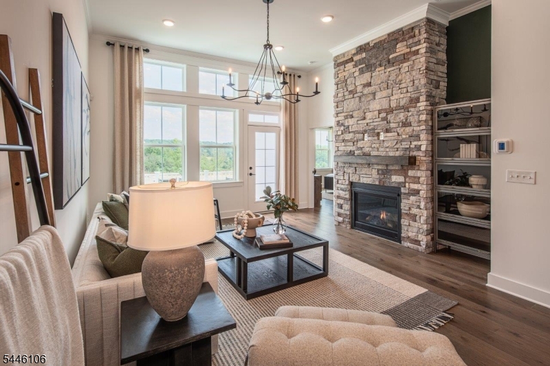 Located in the highly desirable borough of Far Hills, just minutes from the Far Hills train station and downtown Bernardsville, this beautifully appointed Walkout Addley plan offers refined living in a premier setting. The home features a stunning kitchen with designer appliances and a large center island, seamlessly flowing into the open-concept dining area and great room. This inviting space is ideal for entertaining. The first-floor primary suite offers exceptional comfort with walk-in closet and a private en suite bath. Also on the main level is a private home office, providing an ideal space for working from home. The second floor includes two spacious bedrooms, each with its own walk-in closet along with a generous loft area perfect for additional living or relaxation space. Anticipated delivery is Feb/March 2027. This is an age-restricted community. Still time to select custom design options. Photos are of a similar home.