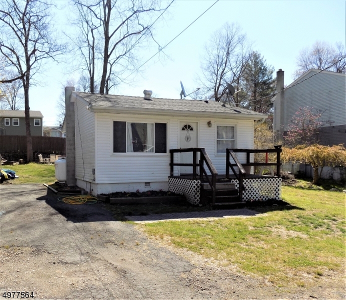 WHY RENT WHEN YOU CAN OWN!!  CUTE AS A BUTTON. 1 BEDROOM RANCH w/DEN. MOVE IN CONDITION. UPDATED KITCHEN, BATH, FLOORING, WINDOWS.  LEVEL LOT W/ EXPANSION POSSIBILITIES & SO MUCH MORE. NEW FURNACE, WELL PUMP,WELL TANK,WATER TREATMENT SYSTEM,NEW HOT WATER HEATER,HOME WAS COMPLETELY RENOVATED IN 2012. WANT TO PURCHASE AS INVESTMENT????  CURRENTLY RENTED ON MONTH-TO-MONTH AT $1100 PER MONTH & TENANT WOULD STAY.   GREAT RETURN ON YOUR $$$