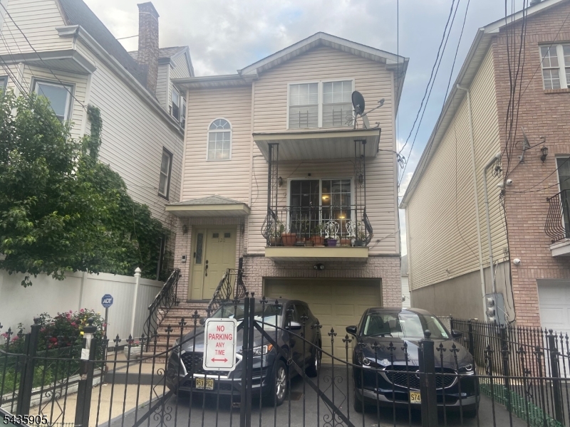 Well kept two family with first floor Balcony!  Off Street Fenced Parking..Finished Basement with full bath and Kitchen. Private Back Yard perfect for cookoutsand entertaining. Hardwood floors on both floors. Open style floorplan. Each apartment has 2 full baths.  Second floor tenant in process of moving. Both floors HaveCentral Air Cond.  plenty of natural light!