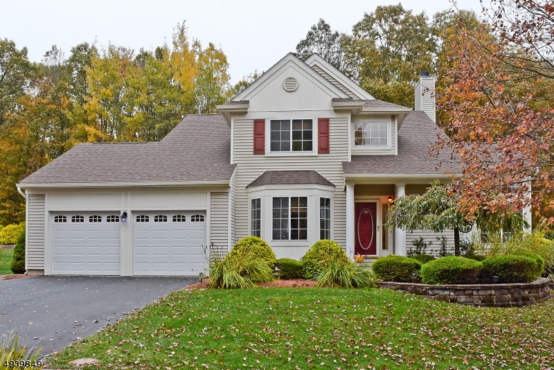 Beautiful Center Hall Colonial with Brazilian hardwood floors throughout, open kitchen with granite counter tops. Formal Dining Room.Living room with wood burning fireplace and vaulted ceilings.Sliders to low maintenance deck that overlooks flat backyard. This home is great for entertaining. Full finished basement with office, media/game room, bonus room and full bath.New roof and gutters and in ground sprinkler system.
