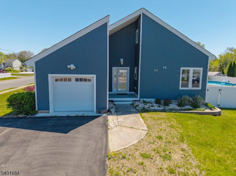 Welcome to your perfect Jersey Shore retreat in the Silverton section of Toms River!!  This beautifully updated home offers the ideal blend of comfort, flexibility & coastal lifestyle iiving!!!  Step inside to discover a bright, open floorplan on the main level, thoughtfully designed for today's modern needs.  With features that include a soaring ceiling, sliders to an oversized deck, and gourmet center-island kitchen--entertaining is effortless!!  Also, on the main level, there are two bedrooms, a full bath and laundry room--creating the perfect setup for guest accommodations, or even a private retreat/office space.  The secnd level features an expansive primary suite, with sitting room, full bath, closet and attic storage.Outdoor living is where this property truly shines!!!  Enjoy summer days and evenings on the expansive deck & patio--ideal for taking a dip in the beautifully-decked above-ground pool, already opened and ready for the season!!!  There's even space to park your boat, making it easy to take full advantage of all the Jersey Shore has to offer!!!  Complete with a one-car garage and solar panels to keep electric costs low--and, located just minutes from beaches, marinas, shopping and dining--this home offers a rare opportunity to own your own slice of the Jersey Shore lifestyle.  Don't miss your chance to make this coastal gem your very own!!!
