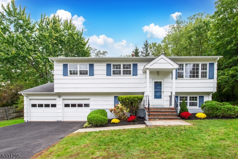 Welcome home to this spacious 4 Bed, 2.5 Bath Bi-Level in a beautiful, private, neighborhood - Original Owner!  This home boasts an Eat-in Kitchen, a Formal Dining Room that flows into a sunny Living Room - all Freshly Painted.  3 Lovely Bedrooms on the First Floor with a Full and 1/2 Bathroom.  A 4th Bedroom is conveniently located on the Ground Floor with an additional Full Bathroom.  In addition, there is a large separate Laundry Room that exits to the beautiful backyard.    Relax in the Family Room that also exits to the patio where you can enjoy endless outdoor entertainment.    Enjoy one of the largest, oversized backyards in this neighborhood and relax in your own private setting.  The Oversized 2 Car Garage enters into the Ground level and provides plenty of storage and space.   So many beautiful updates - brand new walkway and 2025 Driveway & beautifully maintained landscaping.  Convenient 2024 Shed, newer exterior paint and Roof.    This location provides close access to all major Highways, Newark Airport, trains to NYC and all shopping.  Make this home your own with spacious rooms and a flexible floor plan.   With lower taxes, a pristine location and added outdoor space, this home is an ultimate rare find!