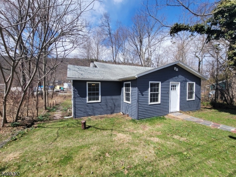 BACK ON THE MARKET WITH A NEW SEPTIC BEING INSTALLED PRIOR TO CLOSING! Welcome to this beautifully renovated 3-bedroom, 1-bath home nestled on a quiet street in the desirable Culver Lake community. Enjoy the ease of one-floor living with all three bedrooms conveniently located on the main level. The home features durable laminate flooring throughout, new kitchen cabinets with granite countertops, and a formal dining area perfect for gatherings. The spacious living room offers a comfortable place to relax and unwind. Upstairs, you'll find two versatile flex rooms, ideal for a home office, playroom, guest space, or creative studio use your imagination! Outside, the flat yard provides great space for outdoor enjoyment. Conveniently located close to the quaint town of Branchville, offering restaurants, shopping, post office, and banking. Outdoor enthusiasts will love the nearby recreation, including the Delaware River, Appalachian Trail, Sunrise Mountain, Stokes State Forest, or catching a game at Skylands Stadium. This home offers the option to join the Culver Lake community, featuring a clubhouse, beach, playground, cantina, and the rare perk of motor-boat access. A wonderful opportunity to enjoy lake living with modern updates don't miss it!