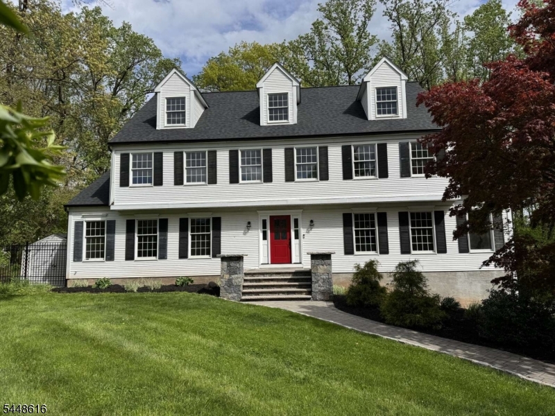 Tucked away at the end of a quiet cul-de-sac, this beautifully updated home offers exceptional privacy while remaining just minutes from Route 78. Mature trees provide a peaceful backyard setting with summer shade, while the home's southern exposure fills the interior w/abundant natural light throughout the winter. Extensively renovated in 2025, this move-in-ready home features a new roof & gutters, new HVAC system, refinished hardwood floors, fresh neutral paint throughout & a sunlit new kitchen w/custom cabinetry, quartz countertops, updated lighting & modern hardware. Both full bathrooms have been completely remodeled, including a luxurious primary bath with a spacious walk-in shower, freestanding soaking tub & quartz vanity. The walkout basement features new luxury vinyl plank flooring & refinished stairs. The spacious eat-in kitchen offers a large island with seating for 3, a generous pantry, & sliding doors leading to an expansive deck that spans the length of the home. Overlooking the backyard is a custom gunite pool with an attached hot tub & waterfall, creating a private outdoor retreat perfect for relaxing or entertaining. Inside, you'll find a living room, dining room, gathering room with a wood-burning FP, laundry room & a flexible extra room.The primary suite has a walk-in closet; 3 additional bedrooms feature hardwood floors, ceiling fans & ample storage. Beautifully updated, thoughtfully designed & ideally located, this home is truly worry free &move-in ready!
