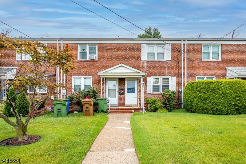 Welcome to this exceptionally well-maintained duplex offering comfort, functionality, and thoughtful updates throughout. This move-in-ready home features a newer heating system and central air conditioning for year-round comfort.The renovated kitchen is equipped with stainless steel appliances, all included, and flows into a separate formal dining room perfect for everyday living and entertaining. The spacious living room provides plenty of room to relax and features a large front-facing window overlooking the expansive green front yard.Toward the rear of the home, you'll find a bright enclosed porch that makes an ideal home office, den, or flex space. A window overlooks the private one-car driveway. While the backyard is low maintenance, it is fully fenced on both sides with durable metal fencing and includes a charming garden area where the current owner grows herbs such as mint and thyme.Upstairs are two generously sized bedrooms filled with natural light. The primary bedroom offers two closets, including a walk-in closet, while the second bedroom is also spacious and bright. A full bathroom in excellent condition completes the second floor.The full, clean unfinished basement includes the utility area, laundry area, and abundant space for storage, a home gym, workshop, or more.Conveniently located near shopping, schools, parks, major highways, and public transportation, this is a wonderful opportunity to own a meticulously maintained home in Linden.