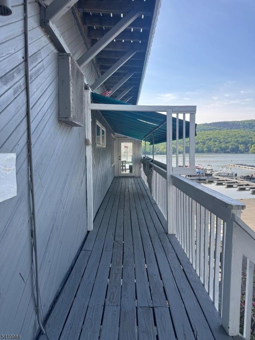 The bar and restaurant offer indoor and outdoor seating for 100 with amazing views.  This is a unique opportunity with 300 feet of lakefront. Commerical Grade Oven, Water Heater, natural gas, and public water