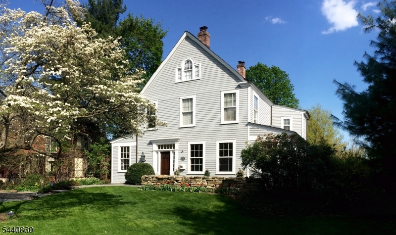 Bathed in beautiful southwest light and set on a prominent corner lot, this remarkable 1888 Victorian farmhouse offers the perfect balance of historic charm, modern comfort, and an exceptional blend of indoor/outdoor living. Known for its appearance in more than twelve national commercials, the home is beloved for its gracious proportions, soaring 12ft ceilings, open flow, and sun-filled interiors. The heart of the home is the beautifully renovated kitchen, where skylights illuminate abundant Parsons cabinetry, expansive counter space, a charming seating nook, granite countertops, a Viking range, and a Sub-Zero refrigerator. A practical mudroom and semi-finished basement add flexibility and functionality. The primary suite features a fireplace, WIC, and luxurious bath. Flexible third floor space with bedroom, bath and laundry. Step outside to discover a backyard designed for unforgettable entertaining. The landscaped grounds feature an inground pool surrounded by Vermont quarry granite decking, a tranquil koi pond, and a custom clubhouse built by the current owner. Recent upgrades include replacement of AC units, freshly painted interiors. Perfectly positioned between both Glen Ridge and Bloomfield Midtown Direct train and central to all top-ranked public schools, this is a rare opportunity to own one of the area's most iconic and admired homes.
