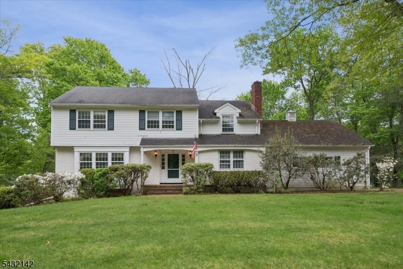Situated on one of the most desirable streets in town, this spacious four-bedroom property presents an exceptional opportunity to create the home of your dreams in a truly premier location. Generous living spaces and endless potential for customization, the residence offers incredible opportunity. Hardwood floors extend throughout the home, adding warmth and classic appeal to every room. The inviting family room serves as a central gathering space and features a charming wood-burning fireplace, perfect for cozy evenings and entertaining during the cooler months. A beautiful sun porch overlooks the backyard and provides the ideal setting for morning coffee, quiet relaxation, or enjoying the changing seasons year-round. The backyard itself offers a private and picturesque outdoor retreat with ample room for entertaining, gardening, or future enhancements. The home's layout provides excellent flow and functionality, with four generously sized bedrooms and comfortable living areas designed for everyday living. The walkout basement offers additional space, storage, and future finishing potential. While the property would benefit from updating, it offers a rare chance to bring your personal vision and style to a home in an outstanding neighborhood. Combining location, space, hardwood flooring throughout, and classic features rarely found today, this is an incredible opportunity for buyers looking to invest in a home with lasting value and unlimited potential.