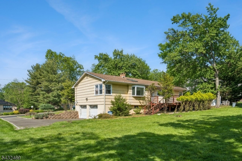 Let's pick your 4 Leaf "Clover".This spacious ranch offers the ease of one-floor living with generously sized rooms, 3 bedrooms, and 2 baths   ready for your vision and worth the effort.The living room has a fireplace, dining with bright windows and eat in kitchen.A large lower level with access through the 2-car garage offers endless possibilities for recreation, workspace, or extended living, complete with an additional powder room. . Catch the NYC bus on the corner, football, soccer, lacrosse or softball games are nearby at Panther Park. Town pool, tennis, playground, basketball are within minutes. You also might explore the reservation trails. Shopping, dining and train await over the hill in Upper Montclair Village. The high school and middle school are within close proximity for convenience and community.. Ready for it's next chapter, this home presents a wonderful opportunity to be restored and reimagined to its' former splendor.
