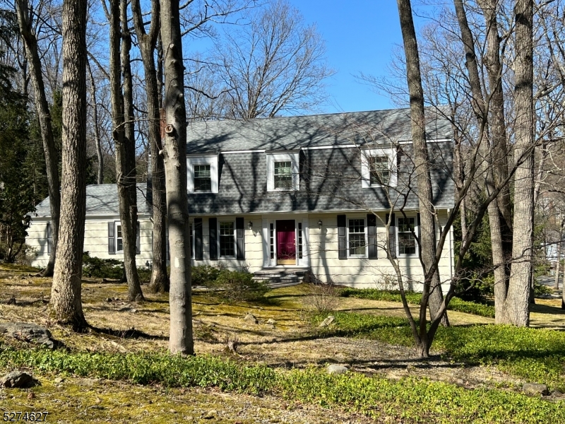Welcome Home to 23 Lord William Penn Drive!  Situated on an oversized corner piece of property in one of Morris County's most sought out private, beautiful neighborhoods in Bradford Estates.  Set back from the road, enjoy several different beautiful vantage points of vast greenery this corner lot offers.  Added blacktop at the end of the driveway circling around to the rear of the house for additional parking or storage.  Enter into an oversized spacious bright and airy foyer with added light from the natural sunlight beaming through the windows in the Living Room on the right and the Family Room on the left as well as the double sliding glass doors straight ahead into the Kitchen.  A HUGE finished basement with an office to work from home, an added over-sized storage room and a huge exercise or gaming room!  Access to the outside through double sliding glass doors.  Bright, open Kitchen featuring modern cabinetry and drawers throughout, granite countertops with stainless steel sink and granite backsplash.  Formal Dining Room w/hardwood floors and tons of natural light.  Family Room w/brick wood-burning fireplace w/raised flagstone hearth.  Bedrooms feature wall-to-wall carpeting w/hardwood underneath.  Enjoy a private alcove in the Master Bedroom w/walk-in closet.  Expansive outdoor deck with access from the Dining Room is the perfect place for endless nights of entertainment.  This home truly encapsulates elegant living with peace, privacy and beauty!